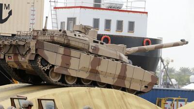 A tank rolls into action at the show. AFP