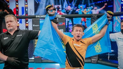 Bagdat Zhubanysh of Kazakhstan celebrates after defeating Russia's Farkhod Rakhmonaliev via unanimous decision.
