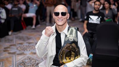 Ali Al Qaisi with his UAE Warriors featherweight belt. Photo: UAE Warriors