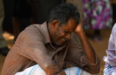 A relative of a Sri Lankan victim of an explosion at a church weeps outside a hospital in Batticaloa, eastern Sri Lanka. AFP