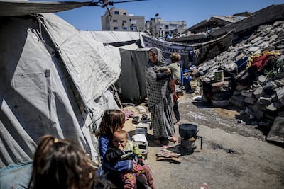 Palestinians displaced by Israeli attacks in a makeshift camp in the Al Rimal neighbourhood of Gaza city. AFP
