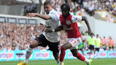 Tottenham Hotspur's Kyle Walker, left, spent much of the day defending the Spurs' goal against Yao Gervinho and other Arsenal threats before finding his way forward to score the game-winner.