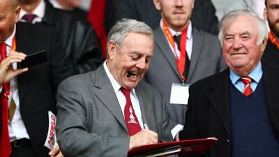 Ian St John with British comedian Jimmy Tarbuck at a Liverpool v Tottenham game at Anfield in 2014. Reuters