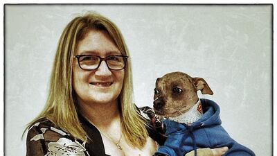 Bev Nicholson from Peterborough poses for a photograph with her Chinese Crested dog, Mugly.