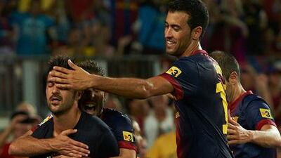 David Villa celebrates his goal against Real Sociedad with his Barcelona teammates