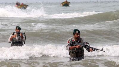 A handout photo made available by the Iranian Navy shows forces during a navy drill in the Strait of Hormuz. EPA, HO