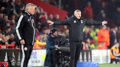 Manchester United manager Ole Gunnar Solskjaer, right, and his Sheffield United counterpart Chris Wilder. PA