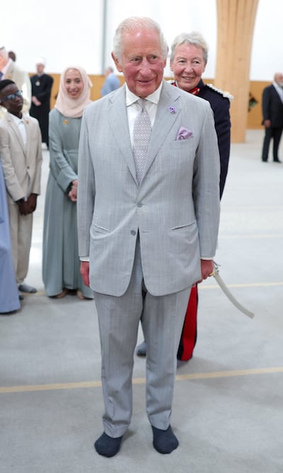 A shoe-less King Charles at the eco-friendly mosque. AFP