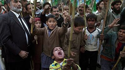 A Pakistani boy shouts slogans along with other protesters during a rally to condemn a Nato helicopter attack on Pakistani troops on Sunday. Muhammed Muheisen / AP Photo