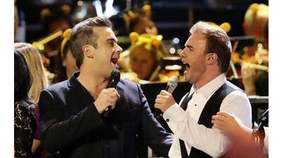 Robbie Williams will be reuniting with Gary Barlow, right, and the other members of Take That for a new album to be released later this year. Williams left the popular boy band in 1995.