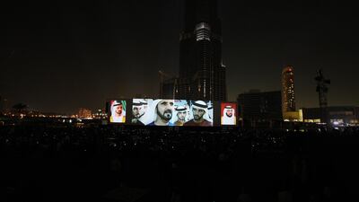 The image of Sheikh Mohammed bin Rashid, Vice President and Ruler of Dubai, is displayed on a big screen during the grand opening of the Burj Khalifa. Amy Leang / The National