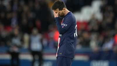 PSG's Lionel Messi touches his forehead in the final minutes as his side head for a 2-0 home defeat against Stade Rennes. AP