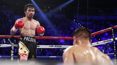 Manny Pacquiao knocks down Jessie Vargas in Round 2. Isaac Brekken / AP Photo