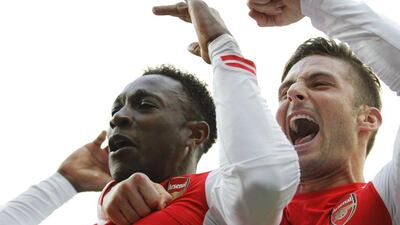 Arsenal's Danny Welbeck celebrates with teammate Olivier Giroud after scoring the winner against West Brom on Saturday in the Premier League/ Ian Kington / AFP / November 29, 2014