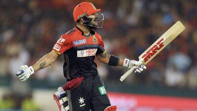 Royal Challengers Bangalore captain Virat Kohli celebrate after wiiing the match against Delhi Daredevils during the 2016 Indian Premier League (IPL) Twenty20 cricket match between Delhi Daredevils and Royal Challengers Bangalore at Shaheed Veer Narayan Singh International Cricket Stadium,Raipur on May 22, 2016. Noah Seelam / AFP