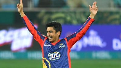 Karachi Kings players celebrate the dismissal of a Lahore Qalandars batsman.