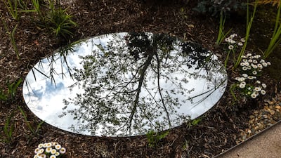 People can relax in a garden with native flowers and shrubs that opens up to the sky. Victor Besa / The National