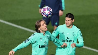 Luka Modric and James Rodriguez compete for the ball during training session in Madrid. Getty