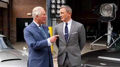 Britain's Prince Charles, left, meets British actor Daniel Craig as he tours the set of the 25th James Bond film at Pinewood Studios. Getty