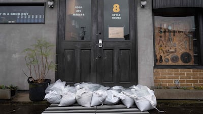 Sandbags in front of a closed restaurant in Izumi. AFP