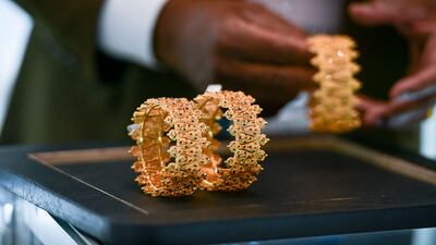 In 2023, gold will finally find its footing after a challenging 2022, according to Saxo Bank. Khushnum Bhandari / The National