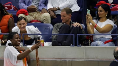 Model Bella Hadid poses for a selfie with a fan during a changeover in the match between Serena Williams and Danka Kovinic. Reuters