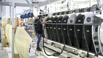 A Worker working on the parts for Airbus and Boeing in the Assembly section at the Strata Manufacturing facility in Al Ain. Pawan Singh/The National