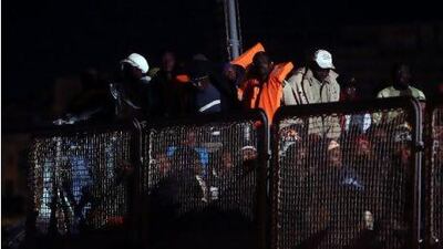 African migrants disembark from a naval patrol boat at the Maltese port of Valetta after being rescued at sea. With tens of thousands of migrants from North Africa arriving on its shores or stranded by smugglers in its territorial waters, Malta requires assistance from the European Union and others to meet the challenges of migration.