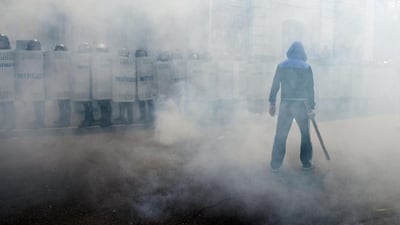 Ukrainian riot policemen fight with “ rioters” as they take part in exercises for mass disturbances suppression in the southern Ukrainian city of Odessa. Alexey Kravtsov / AFP