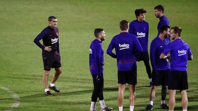 Barcelona manager Ernesto Valverde, left, with his players during training on Wednesday. Reuters