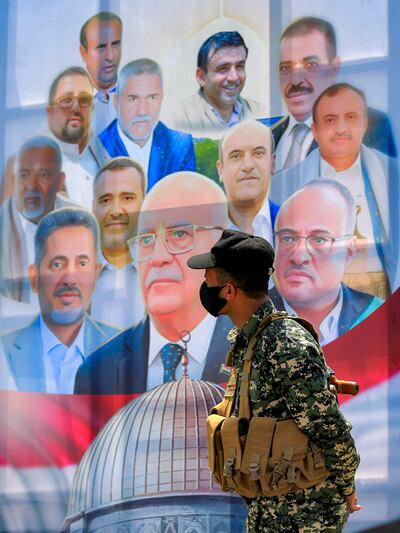 A poster in Sanaa shows senior Houthi officials, including prime minister Ahmed Ghaleb Al Rahwim, who were killed in an Israeli strike on the Yemeni capital. AFP