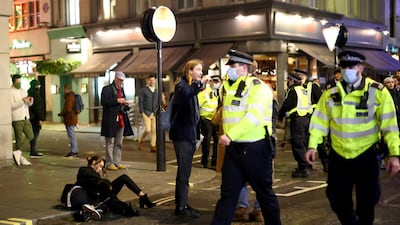 Police officers patrol a street in Soho. Reuters