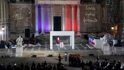 The coffin of slain teacher Samuel Paty is carried away in the courtyard of the Sorbonne university during a national memorial event, in Paris, France October 21, 2020. REUTERS
