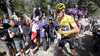 Yellow jersey leader Team Sky rider Chris Froome of Britain runs on the road after a fall. Jean-Paul Pelissier / Reuters