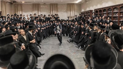 Israeli Ultra-Orthodox Jews celebrate the release of a student detained for failing to appear for military service. AFP