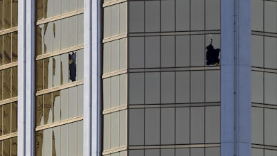 The damaged windows on the 32nd floor room that was used by the shooter in the Mandalay Hotel after a gunman killed at least 58 people and wounded more than 500 others when he opened fire on a country music concert in Las Vegas, Nevada. Mark Ralston / AFP