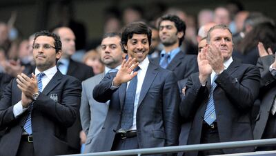 Manchester city owner Sheikh Mansour bin Zayed Al Nahyan (C) looks on during the English Premier League football match against Liverpool at The City of Manchester stadium, Manchester, north-west England on August 23, 2010. AFP PHOTO/ANDREW YATES. FOR EDITORIAL USE Additional licence required for any commercial/promotional use or use on TV or internet (except identical online version of newspaper) of Premier League/Football League photos. Tel DataCo +44 207 2981656. Do not alter/modify photo (Photo by ANDREW YATES / AFP)