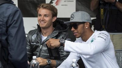Mercedes driver Nico Rosberg, left, wants to beat teammate Lewis Hamilton on the track and not in the press as the German was cautious with reporters on Friday ahead of the Canadian Grand Prix. Paul Chiasson / AP Photo