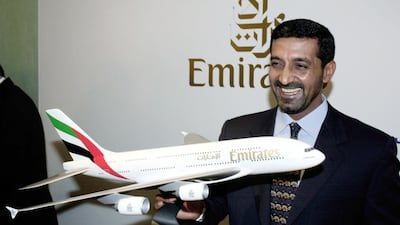 Emirates chairman Sheikh Ahmed bin Saeed with a model of the new A3XX superjumbo jet at the Farnborough Air Show in 2001. Getty Images