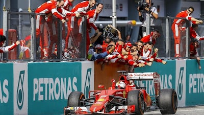 Vettel celebrates after winning the 2015 Formula One Grand Prix of Malaysia. Azhar Rahim / EPA