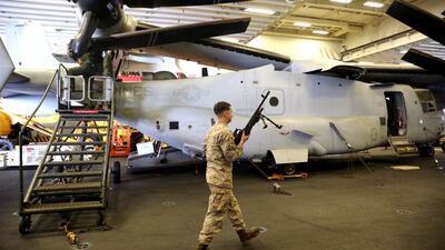 A US Marine carries his M240B machine gun during regular training.