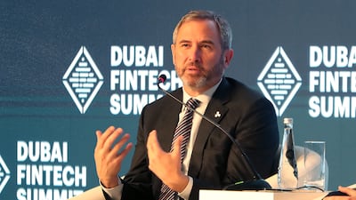 Brad Garlinghouse, chief executive of Ripple, speaks at the Dubai FinTech Summit on Monday. Pawan Singh / The National