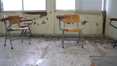 Pieces of fallen wall plaster litter the floor of a classroom at the Lebanese University. Matt Kynaston / The National