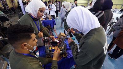 Libyan youths take part in the yearly First Tech Challenge, a country-wide robotics competition, as regional qualifiers for Libya begin in the eastern city of Benghazi, on Febryary 3, 2022. (Photo by Abdullah DOMA / AFP)