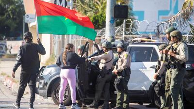 Law enforcement and demonstrators at close quarters during a protest in the Compton suburb of the city. AFP