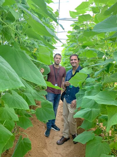 Yazen Al Kodmani, operations manager from Emirates Bio Farm, (L), with founder and CEO of The Arbor School Dr Sa'ad Al Omari inside a biosphere where children are taught sustainable farming. Courtesy: The Arbor School