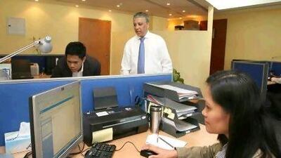 Ron Ribeiro talks to his employees before the beginning of their work day. Mike Young / The National