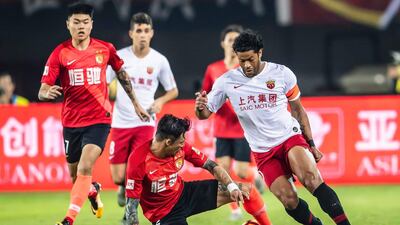 Shanghai SIPG, in white, Guangzhou Evergrande, red, are two of four Chinese representatives in this year's Asian Champions League. AFP