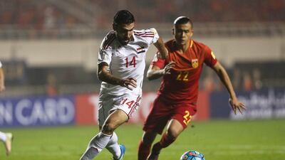 Tamer Haj Mohamad of Syria and Zhang Yuning of China in action. Stringer / Reuters