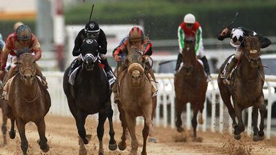 Patrick Dobbs on Second Summer, centre, leads the charge for the Dubai Kahayla Classic. EPA stringer